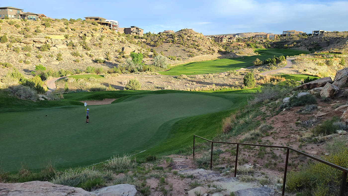 Redlands Mesa Golf Course in Grand Junction CO with desert cliffs and championship fairway views